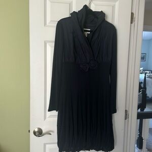 Beautiful dress with lots of style. this dress runs small. fits like a 12